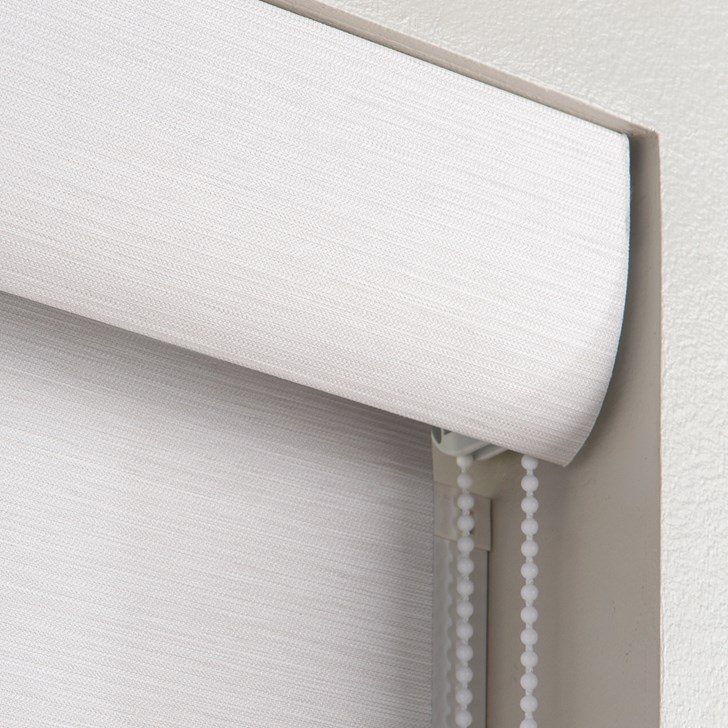 Opacity: Blackout; Color: Shawnee Cascade F0828; Lift: Continuous Corded Loop White Plastic; Valance: Curved Fascia with Fabric Insert; Hem Bar: Plain White; Accessory: Light Guard White