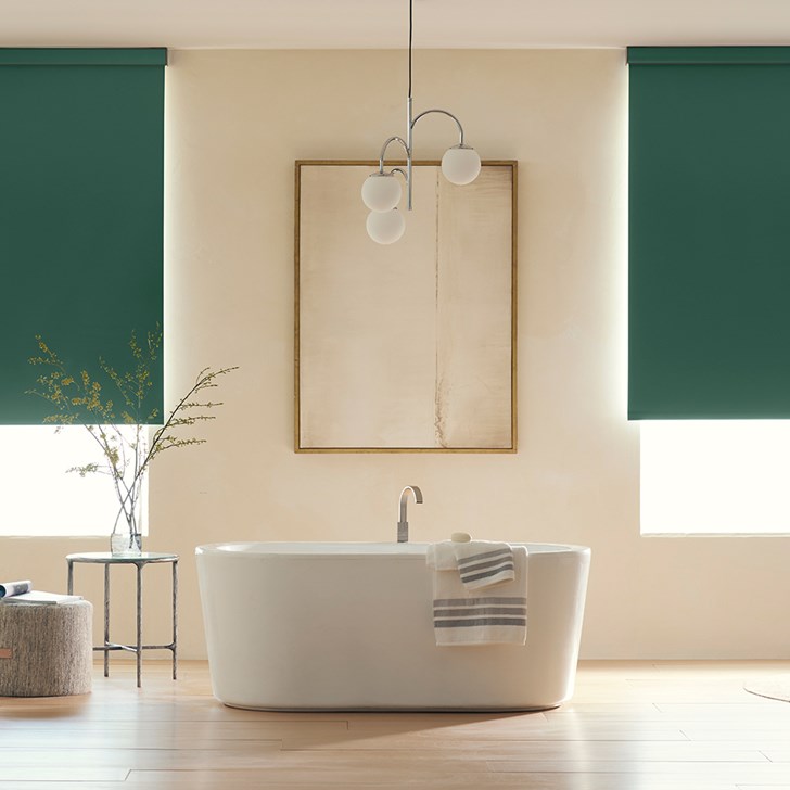 The Economy Blackout Vinyl Roller Shades in the Reminiscent Hunter Green color with the 3in. Fabric Covered Valance.